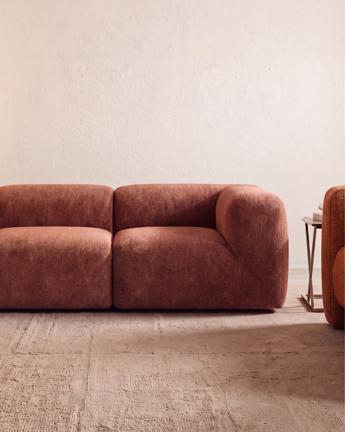 A finished terracotta Floom sofa in a warm, bright room