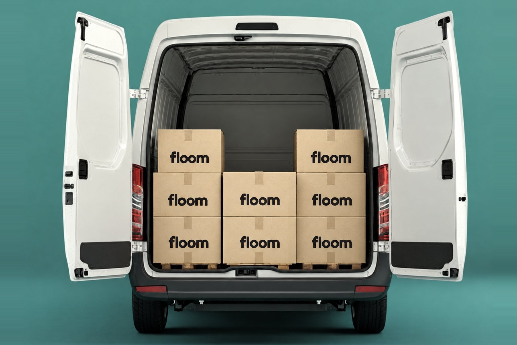 A delivery van with its rear doors open, loaded with stacked Floom boxes